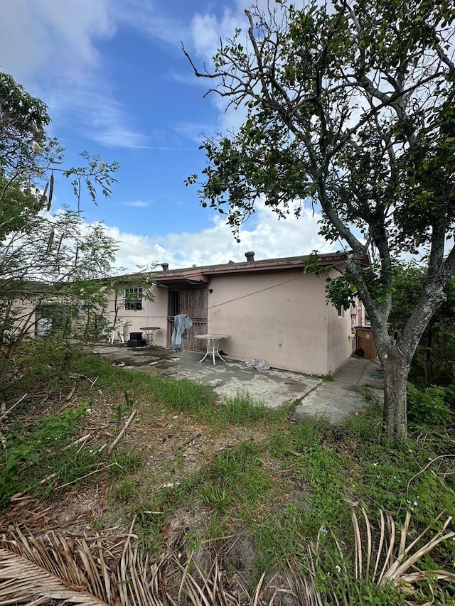 1360 SW 6th Ter, Deerfield Beach, FL 33441 - rear view of property featuring stucco siding