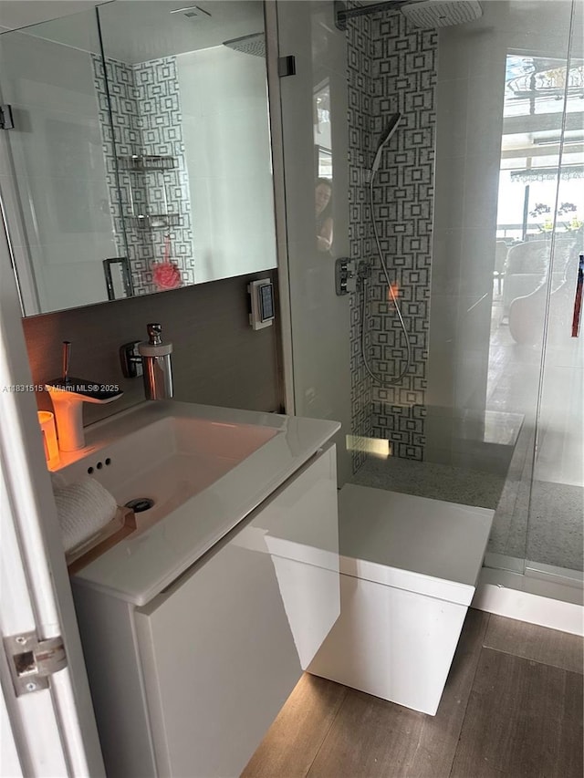 2333 Brickell Ave Unit 901, Miami, FL 33129 - full bath featuring a shower stall, vanity, and wood finished floors