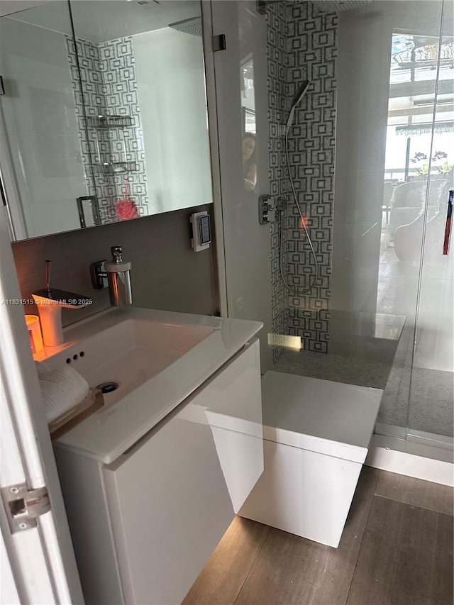 2333 Brickell Ave Unit 901, Miami, FL 33129 - full bath featuring a stall shower, vanity, and wood finished floors