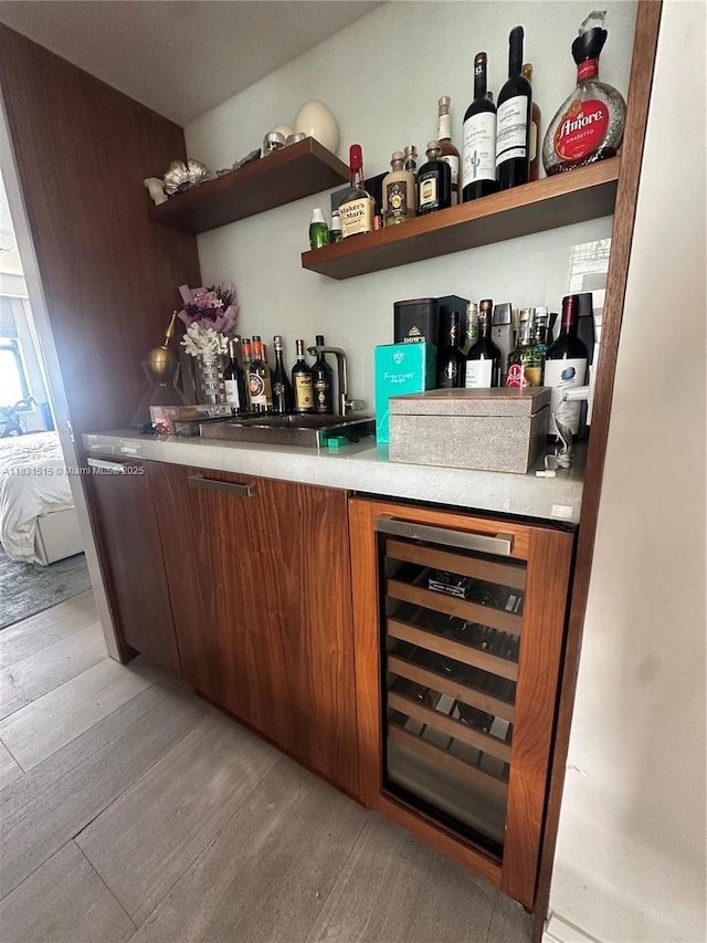 2333 Brickell Ave Unit 901, Miami, FL 33129 - indoor wet bar with beverage cooler and light wood-style floors