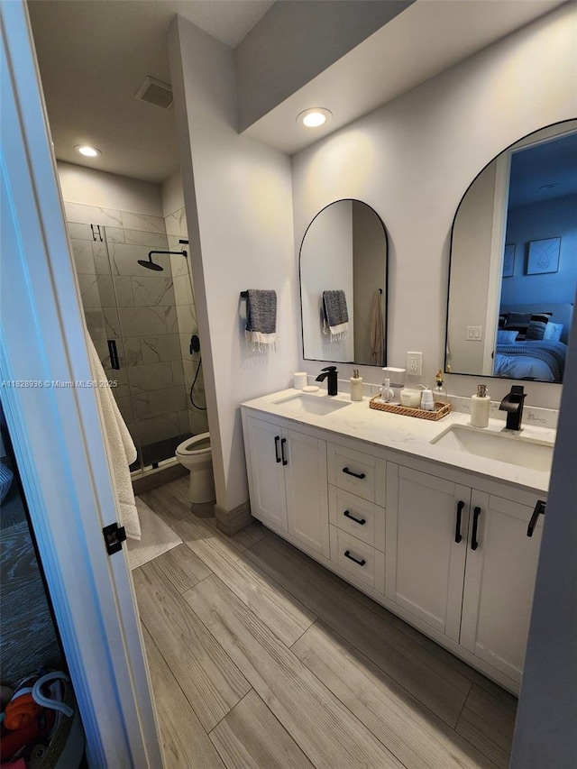 706 SW 147th Ave, Pembroke Pines, FL 33027 - bathroom featuring a stall shower, double vanity, ensuite bath, wood finished floors, and recessed lighting