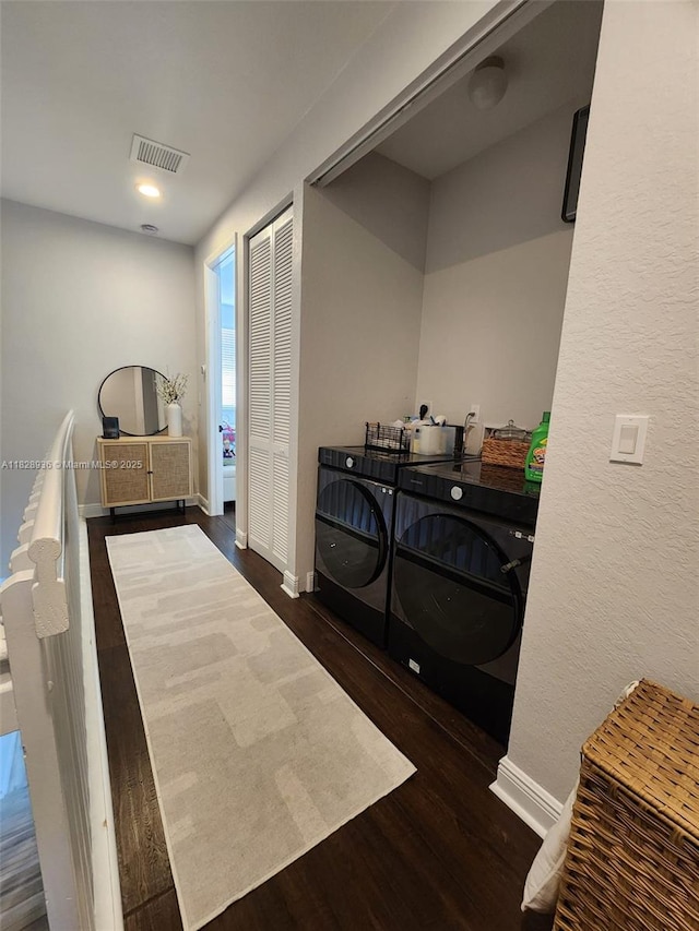 706 SW 147th Ave, Pembroke Pines, FL 33027 - laundry room featuring washing machine and dryer and wood finished floors