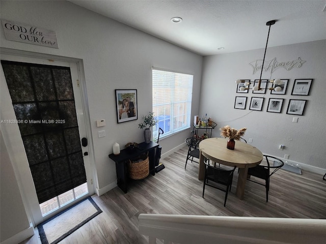 706 SW 147th Ave, Pembroke Pines, FL 33027 - dining area with wood finished floors and a chandelier