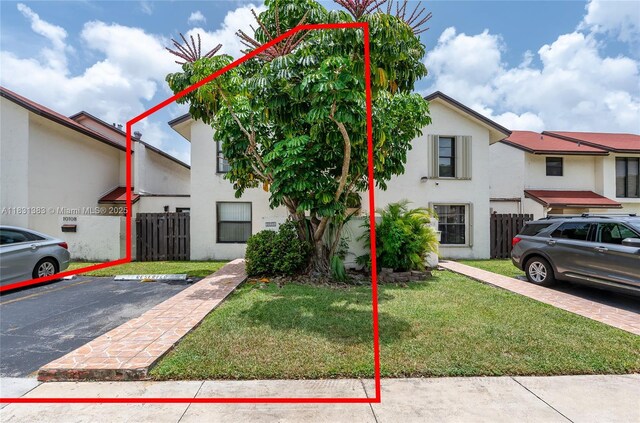 10114 NW 4th Ln Unit 3-12, Miami, FL 33172 - view of property featuring uncovered parking and stucco siding