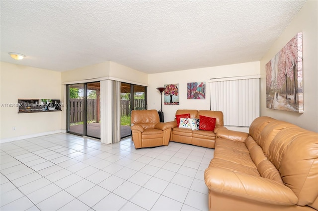 10114 NW 4th Ln Unit 3-12, Miami, FL 33172 - living area featuring light tile patterned floors and a textured ceiling