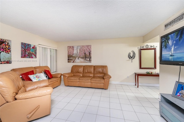 10114 NW 4th Ln Unit 3-12, Miami, FL 33172 - living room with baseboards and a textured ceiling