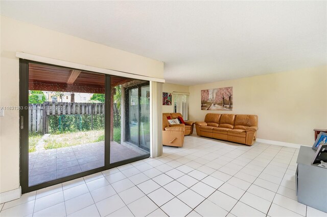 10114 NW 4th Ln Unit 3-12, Miami, FL 33172 - living area with baseboards and light tile patterned floors