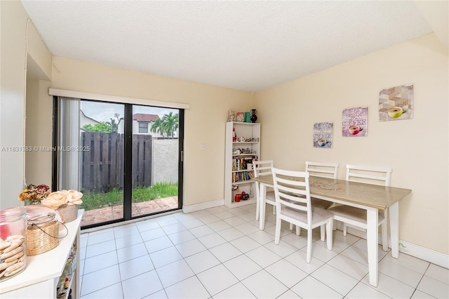 10114 NW 4th Ln Unit 3-12, Miami, FL 33172 - dining room with light tile patterned flooring and a textured ceiling