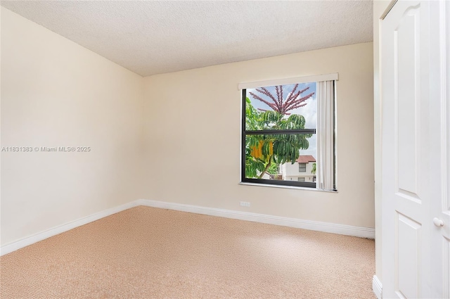 10114 NW 4th Ln Unit 3-12, Miami, FL 33172 - carpeted spare room with baseboards and a textured ceiling