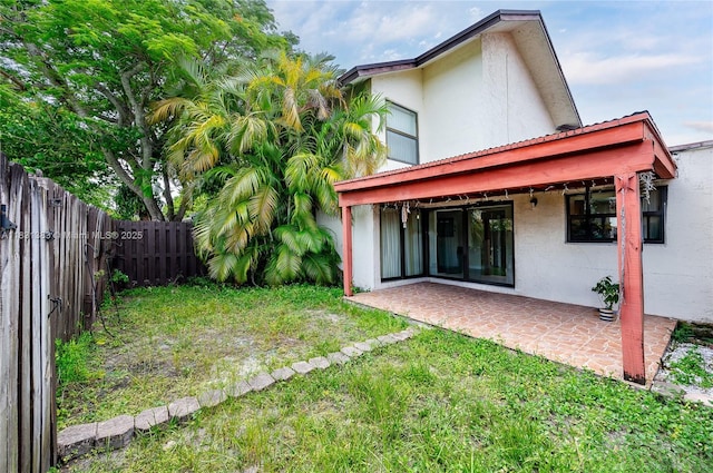 10114 NW 4th Ln Unit 3-12, Miami, FL 33172 - rear view of property with stucco siding, a patio, and a fenced backyard