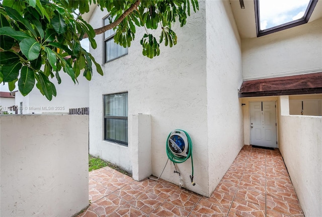 10114 NW 4th Ln Unit 3-12, Miami, FL 33172 - view of exterior entry featuring stucco siding