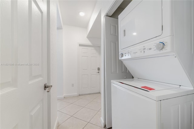 22938 SW 128th Pl, Miami, FL 33170 - washroom featuring stacked washer and clothes dryer and light tile patterned floors