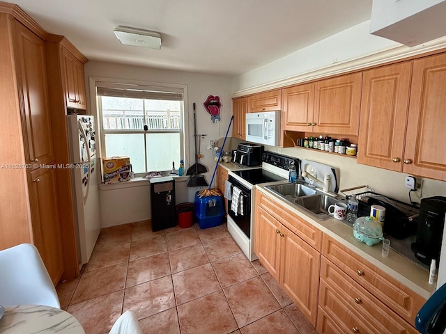 1308 Drexel Ave Unit 109, Miami Beach, FL 33139 - kitchen with white appliances, light tile patterned floors, and light countertops