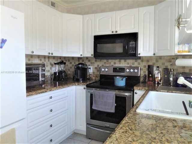 6289 Lear Dr Unit 308, Lake Worth, FL 33462 - kitchen featuring electric stove, black microwave, stone countertops, white cabinets, and crown molding