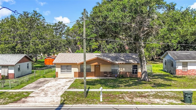 1206 E 27th St, Bradenton, FL 34208 - view of front facade with driveway and stucco siding