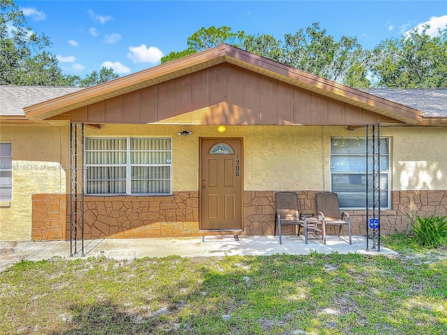 1206 E 27th St, Bradenton, FL 34208 - view of front of home with roof with shingles and stucco siding