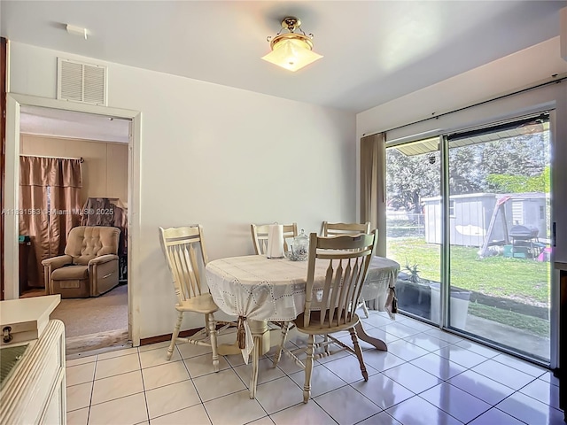 1206 E 27th St, Bradenton, FL 34208 - dining space featuring light tile patterned floors