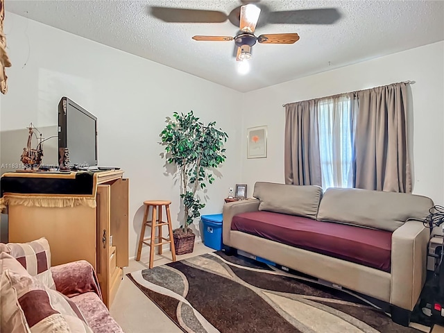 1206 E 27th St, Bradenton, FL 34208 - living room featuring ceiling fan and a textured ceiling