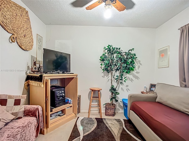 1206 E 27th St, Bradenton, FL 34208 - living area with ceiling fan and a textured ceiling