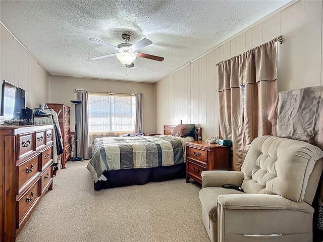 1206 E 27th St, Bradenton, FL 34208 - bedroom with a textured ceiling, carpet, a ceiling fan, and wood walls
