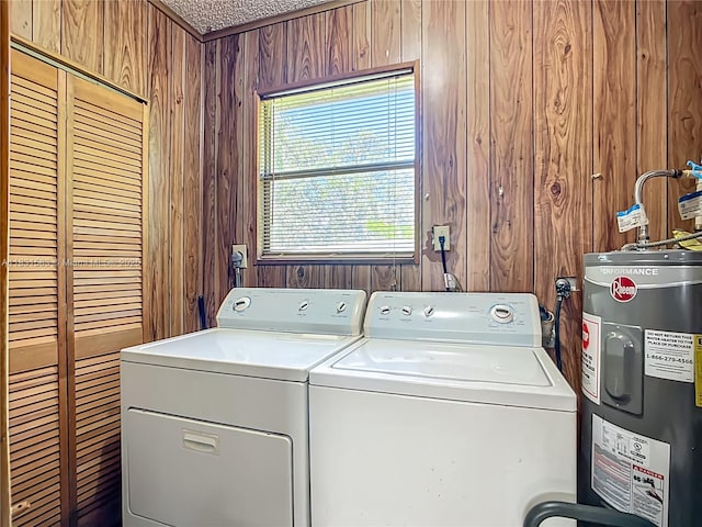 1206 E 27th St, Bradenton, FL 34208 - laundry room with water heater, separate washer and dryer, and wood walls