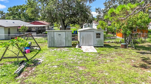 1206 E 27th St, Bradenton, FL 34208 - fenced backyard featuring a storage unit
