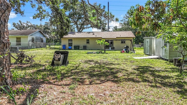 1206 E 27th St, Bradenton, FL 34208 - rear view of house featuring a storage shed and stucco siding