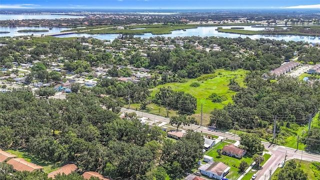 1206 E 27th St, Bradenton, FL 34208 - aerial view of property's location featuring a large body of water and a tree filled landscape