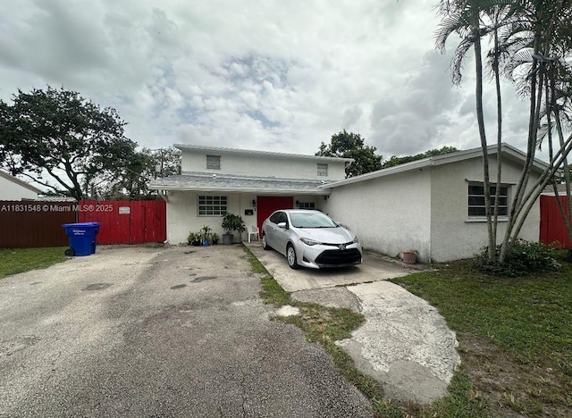 6641 Perry St, Hollywood, FL 33024 - view of front of home with stucco siding and asphalt driveway