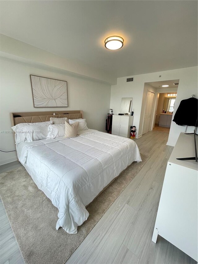 2650 SW 37th Ave Unit 603, Miami, FL 33133 - bedroom with light wood-type flooring