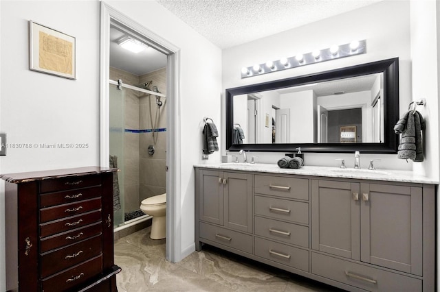 21133 SW 85th Ave Unit 404, Cutler Bay, FL 33189 - bathroom with a stall shower, double vanity, marble look tile flooring, and a textured ceiling