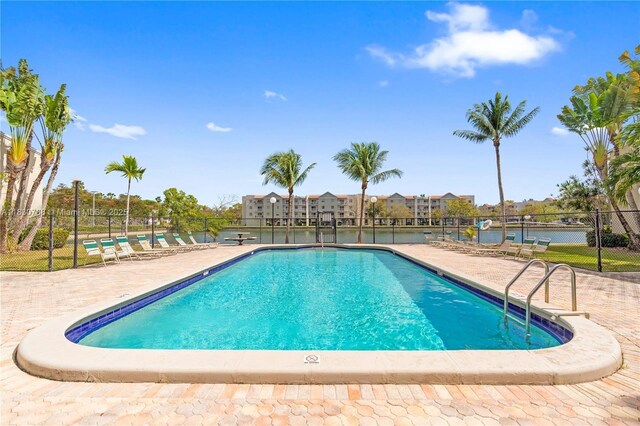 21133 SW 85th Ave Unit 404, Cutler Bay, FL 33189 - community pool with a patio area