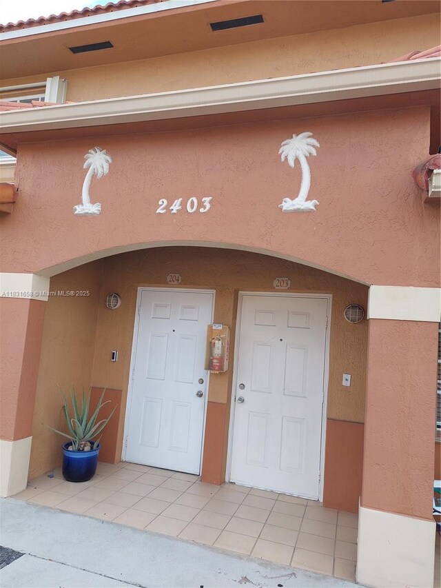 2403 W 76th St Unit 203, Hialeah, FL 33016 - property entrance featuring stucco siding
