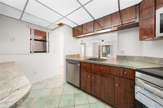 20905 NE 8th Ct Unit 101-36, Miami, FL 33179 - kitchen featuring stainless steel dishwasher, range with electric stovetop, light tile patterned floors, and a ceiling fan