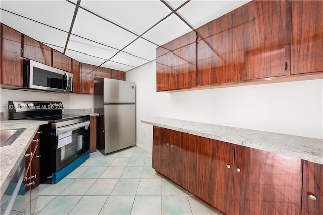 20905 NE 8th Ct Unit 101-36, Miami, FL 33179 - kitchen featuring stainless steel appliances and light countertops