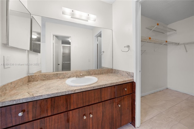 20905 NE 8th Ct Unit 101-36, Miami, FL 33179 - full bath featuring vanity, a walk in closet, an enclosed shower, and tile patterned flooring