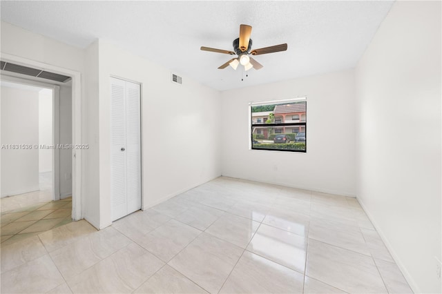 20905 NE 8th Ct Unit 101-36, Miami, FL 33179 - empty room featuring ceiling fan and light tile patterned flooring