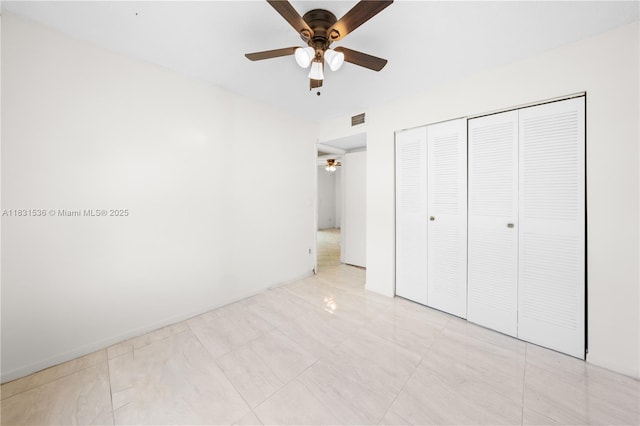 20905 NE 8th Ct Unit 101-36, Miami, FL 33179 - unfurnished bedroom featuring a closet and a ceiling fan
