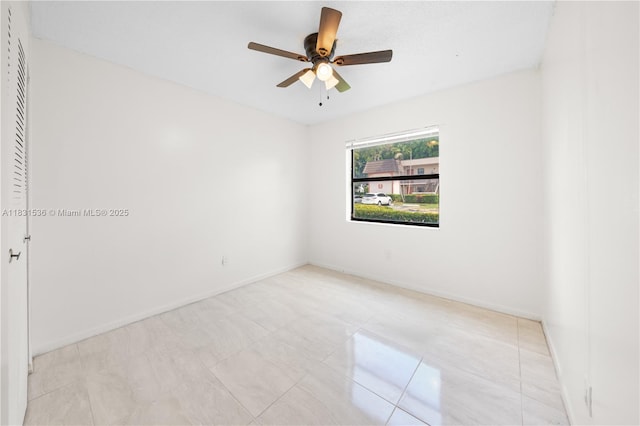 20905 NE 8th Ct Unit 101-36, Miami, FL 33179 - spare room featuring ceiling fan and baseboards