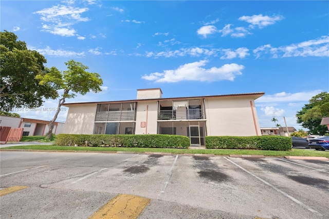 20905 NE 8th Ct Unit 101-36, Miami, FL 33179 - view of building exterior featuring uncovered parking