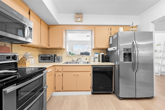 2015 N 37th Ave, Hollywood, FL 33021 - kitchen with stainless steel appliances, light countertops, and light wood-style floors