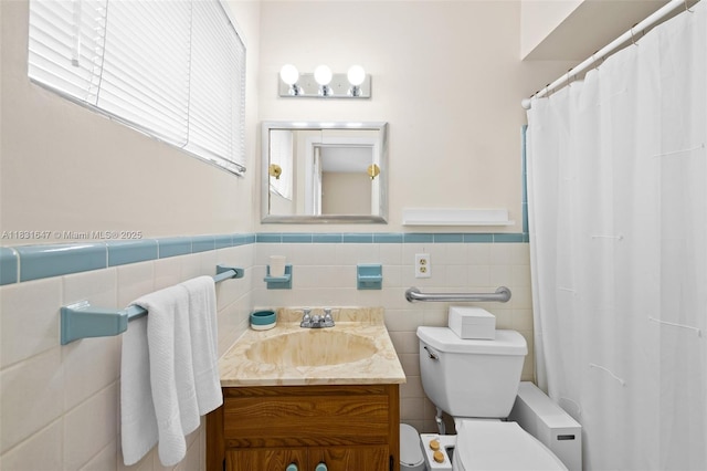 2015 N 37th Ave, Hollywood, FL 33021 - full bath with vanity, wainscoting, tile walls, and a shower with shower curtain