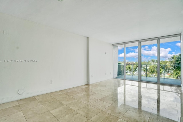 6305 Indian Creek Dr Unit 3B, Miami Beach, FL 33141 - unfurnished room featuring expansive windows and light tile patterned floors