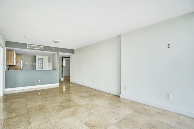 6305 Indian Creek Dr Unit 3B, Miami Beach, FL 33141 - unfurnished living room featuring baseboards