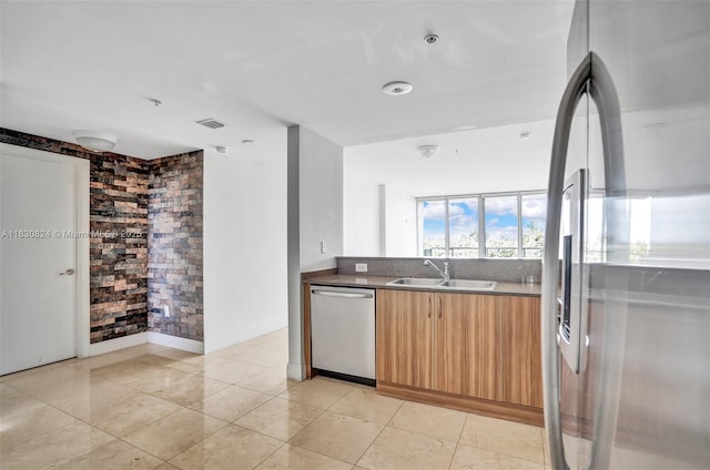 6305 Indian Creek Dr Unit 3B, Miami Beach, FL 33141 - kitchen with appliances with stainless steel finishes, modern cabinets, and light brown cabinets