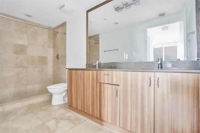 6305 Indian Creek Dr Unit 3B, Miami Beach, FL 33141 - bathroom featuring double vanity, marble finish floors, and a tile shower