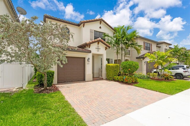 3274 W 96th Pl, Hialeah, FL 33018 - mediterranean / spanish house featuring decorative driveway, a tiled roof, and stucco siding
