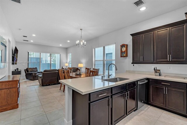 3274 W 96th Pl, Hialeah, FL 33018 - kitchen featuring stainless steel dishwasher, light countertops, a chandelier, a peninsula, and open floor plan