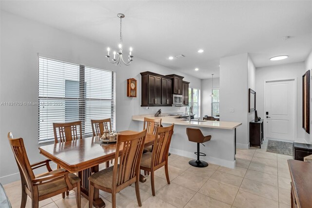 3274 W 96th Pl, Hialeah, FL 33018 - dining space featuring a chandelier, light tile patterned floors, and recessed lighting