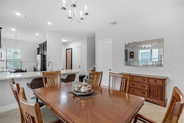 3274 W 96th Pl, Hialeah, FL 33018 - dining area with light tile patterned floors, a chandelier, stairs, and recessed lighting